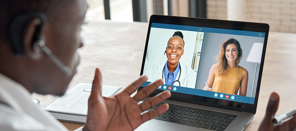 Doctor, patient, and interpreter meeting virtually for a telehealth appointment.